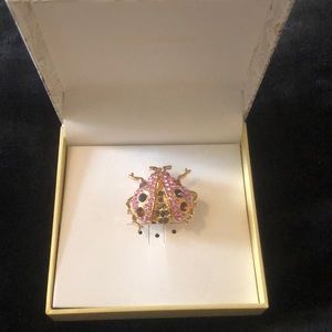 Charter Club ladybug pendant gold with pink and different color stones.
